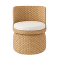 Front view of a seagrass-woven armless swivel accent chair with a rounded back and thick cream fabric seat cushion, natural beige tones and pronounced woven boho-coastal texture.