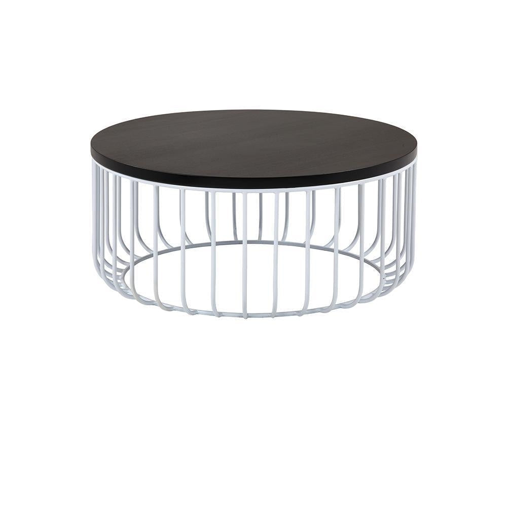 Round coffee table with a dark mahogany wooden top and white iron wire cage base, low-profile rustic design suitable for a living room.