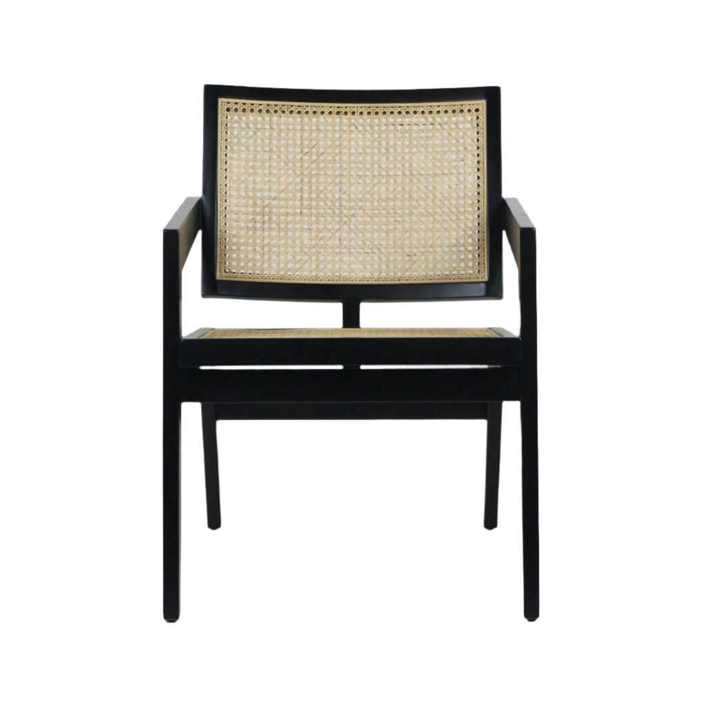 Mid-century modern lounge chair with a black solid wood frame and natural woven cane back and seat, featuring low-profile arms and tapered legs.
