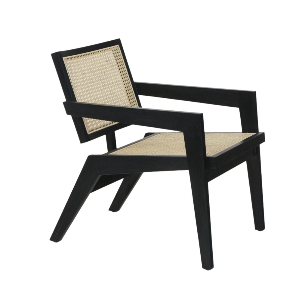 Low-profile mid-century lounge chair with a black solid wood frame and natural woven cane seat and back, angled legs and wide flat arms in a modern Scandinavian-inspired silhouette.
