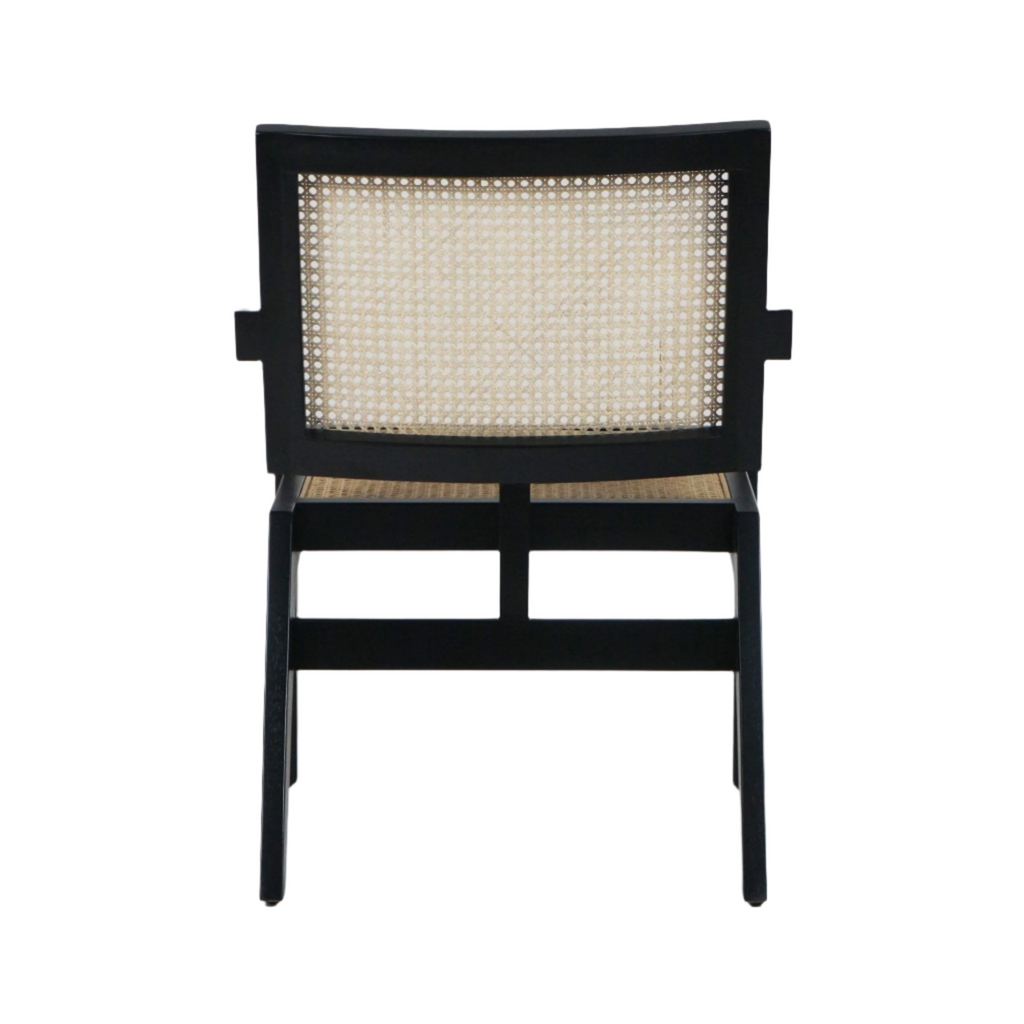 Rear view of a mid-century modern lounge chair with a black solid wood frame and natural woven cane back and seat, showing tapered legs and rectangular back panel.