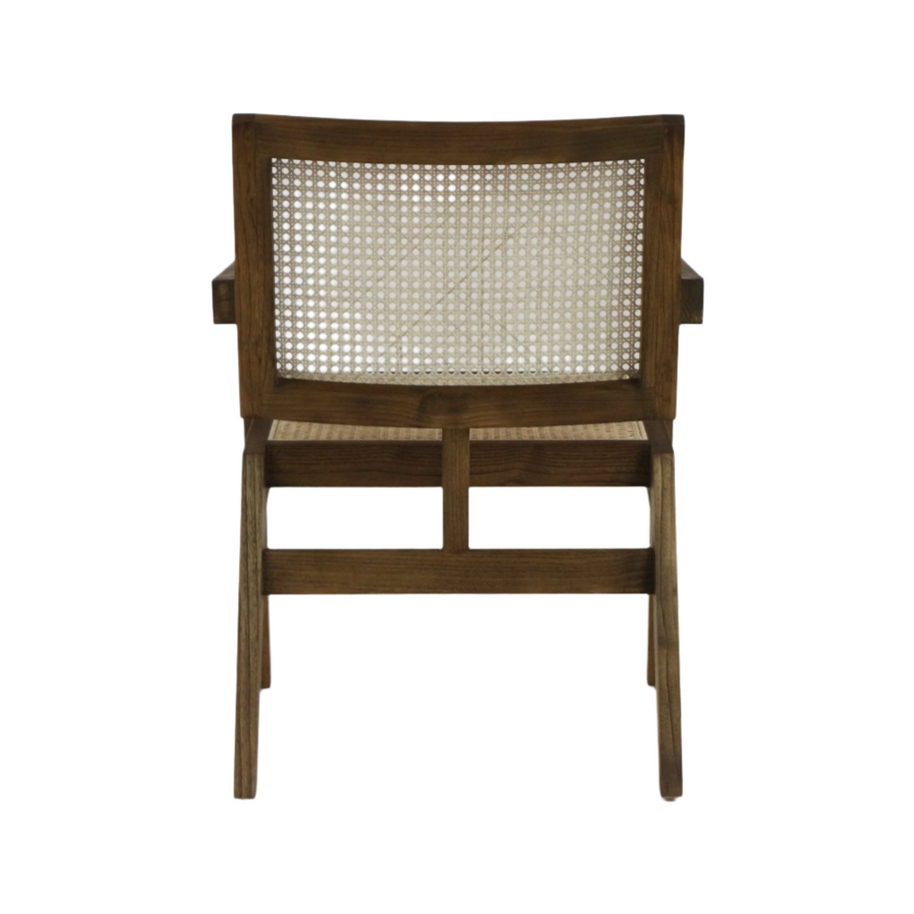 Rear view of a teak-tone solid wood lounge chair with woven cane back and seat, squared armrests and tapered legs in a mid-century modern silhouette.