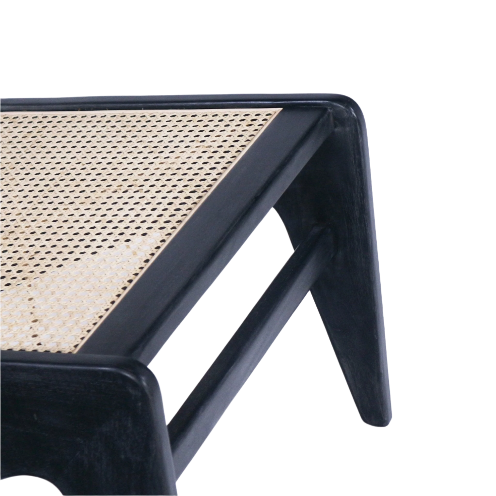 Close-up of a black solid wood chair corner showing a natural woven cane seat inset, tapered leg and horizontal stretcher that highlight the teak frame and cane texture.