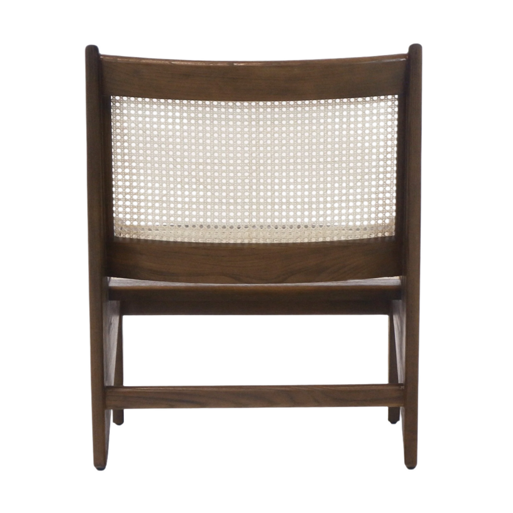 Back view of a mid-century modern teak lounge chair featuring a woven natural cane backrest and warm brown solid wood frame.
