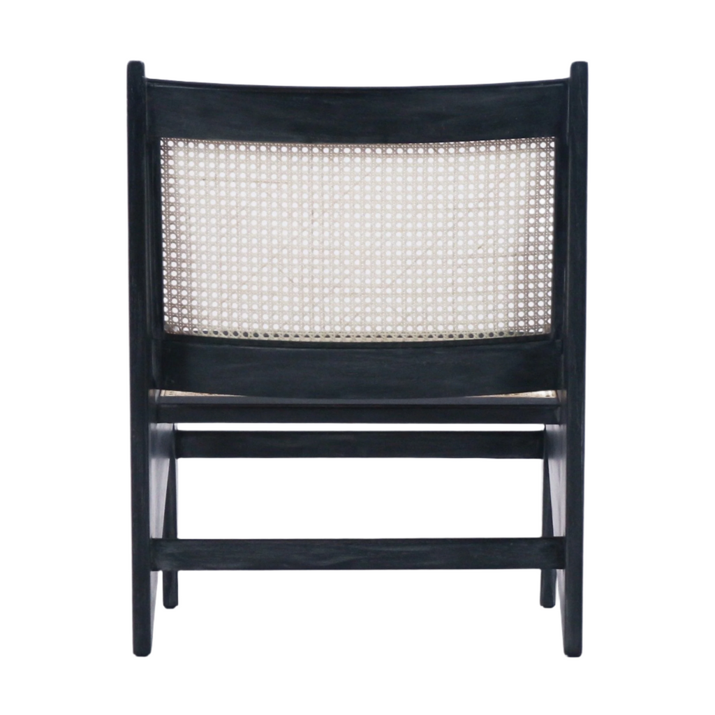 Rear view of a mid-century modern chair with a smoked-black teak frame and natural woven cane backrest, showing low horizontal stretcher bars and tapered legs against a white background.