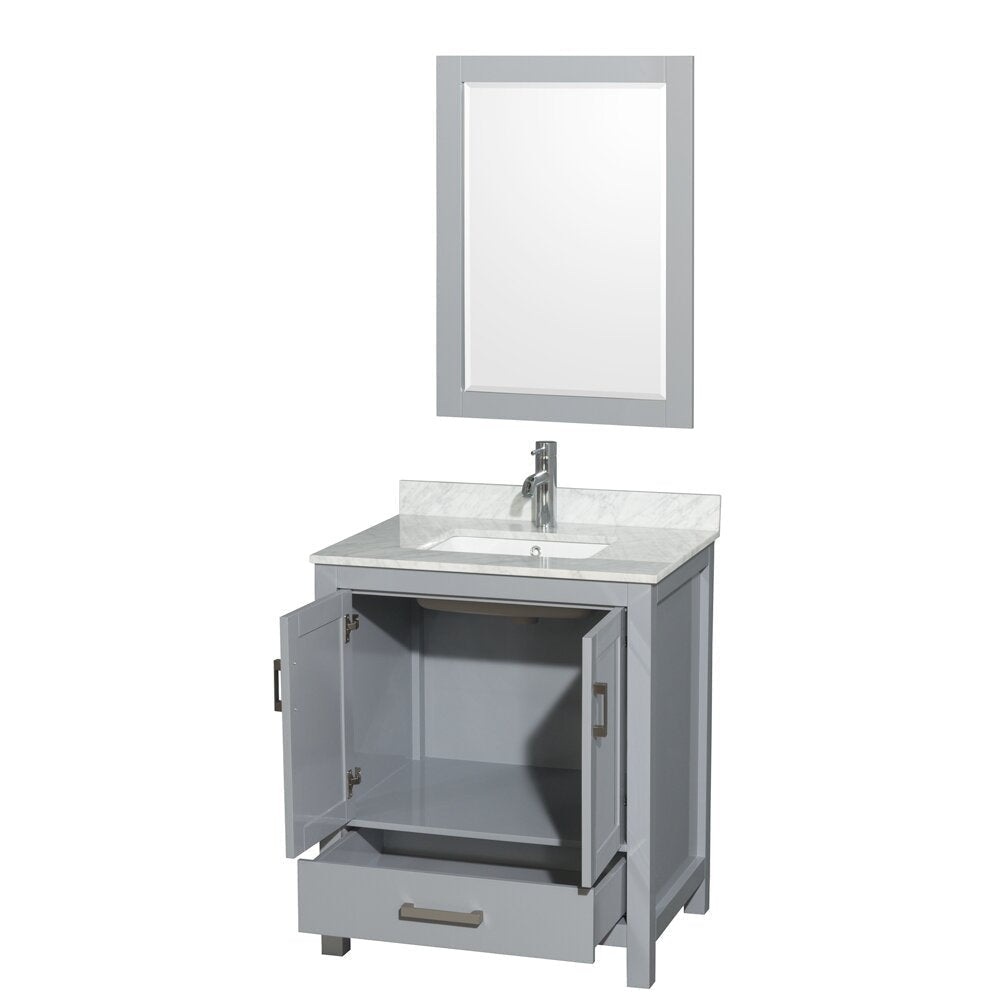Modern gray wooden single-sink bathroom vanity with stone countertop and integrated white ceramic sink, chrome single-handle faucet and matching framed mirror above; cabinet doors open and bottom drawer pulled out.