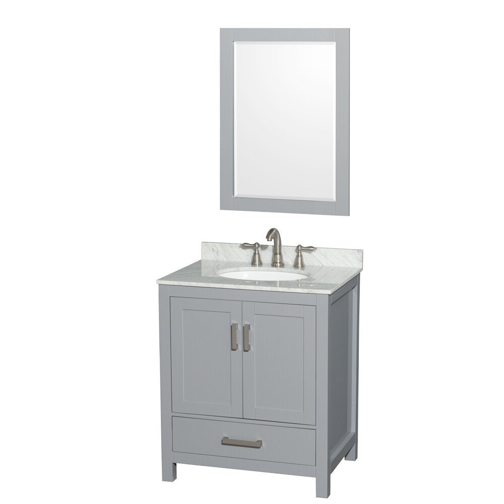 Modern gray solid-wood 30-inch bathroom vanity with a white oval ceramic undermount sink set in a stone countertop, brushed nickel widespread faucet, two-door cabinet with bottom drawer, shown with matching gray framed mirror.