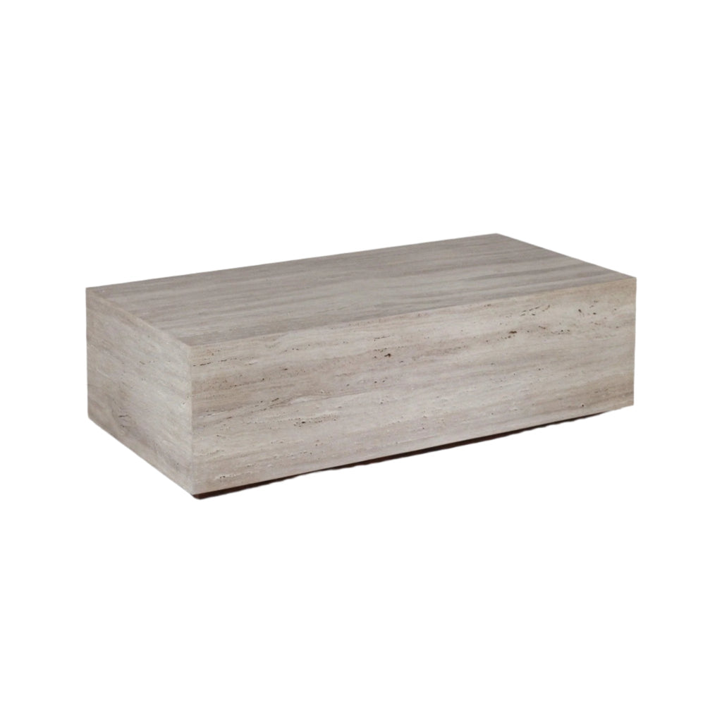 Rectangular coffee table in natural beige travertine, presented as a low solid-block form with clean modern lines and subtle horizontal veining.