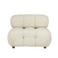Cream boucle upholstered sofa with rounded tufted seat and back, low-profile armless silhouette and short wooden legs for a modern living room.