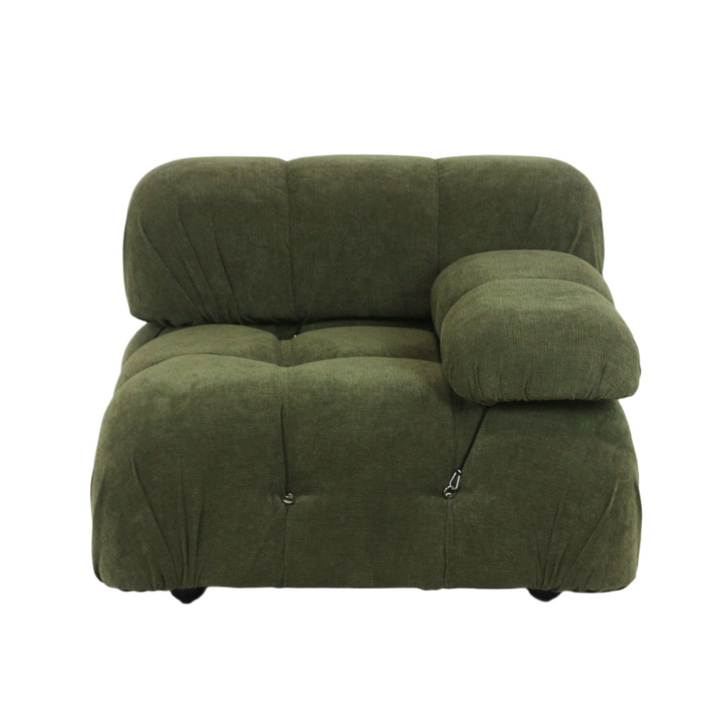 Olive green fabric sofa module with plush, rounded tufted cushions and a single padded armrest secured by a visible strap and metal clip, supported on low black legs.