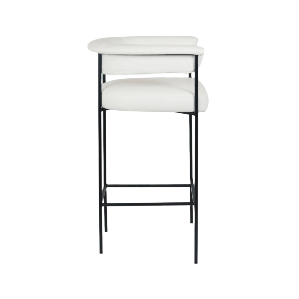White faux-leather counter stool with a padded seat and low curved backrest supported by a slim black metal frame and rectangular footrest, displayed on a plain white background.