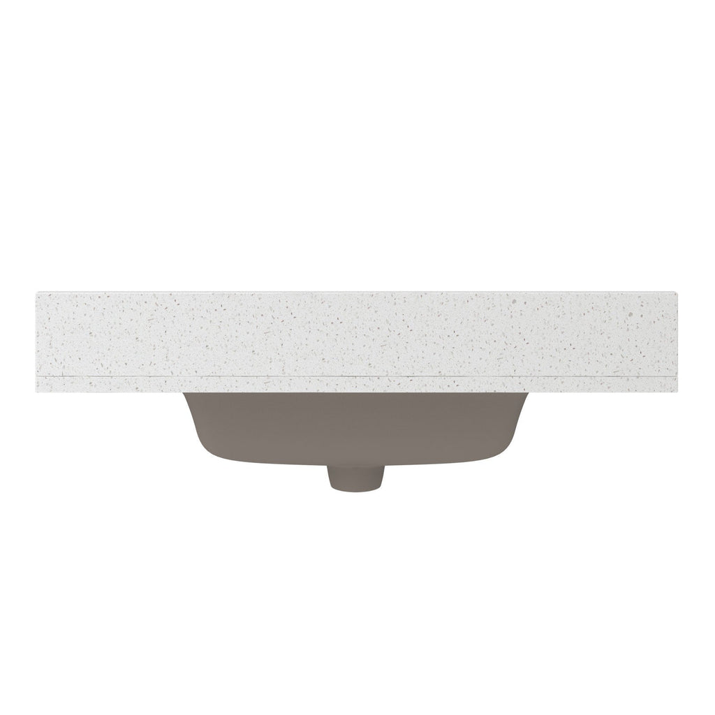 Front view of a speckled stone vanity countertop with a centered undermount ceramic sink in stone color visible beneath, showing the rectangular top edge and curved basin from below.