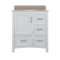 Front view of a 31-inch white solid wood freestanding bathroom vanity with a beige stone top and integrated single ceramic sink, one shaker-style cupboard door and three drawers with modern metal bar handles.