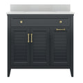 Freestanding solid wood single-sink bathroom vanity in charcoal finish with a white speckled stone countertop and integrated basin, featuring louvered cabinet doors and brass drawer pulls and handles.