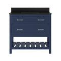 Front view of a navy solid wood single-sink bathroom vanity with a black speckled marble top and backsplash, two large drawers with silver bar pulls, and an open slatted lower shelf.