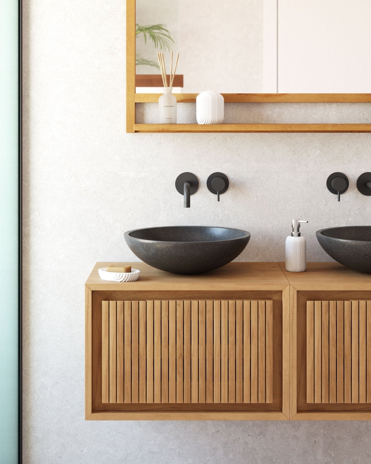 Floating 24-inch solid wood bathroom vanity in a modern style with vertical slatted doors, dark stone vessel sink, matte black wall-mounted faucet, framed wood mirror shelf above, and soap dish and dispenser on a stone-colored wall.