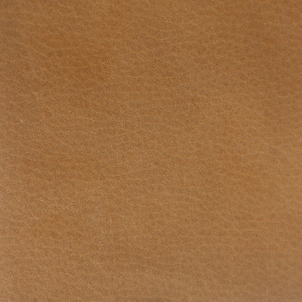 Close-up of tan nubuck synthetic upholstery showing a soft brushed nap and fine texture, suitable for an upholstered dining chair seat.