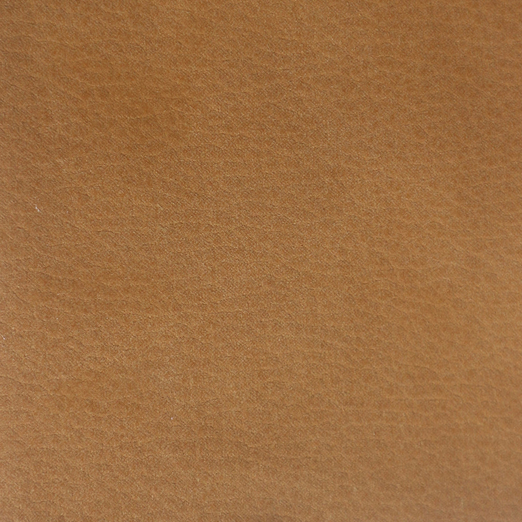 Close-up of tan nubuck synthetic upholstery showing a soft brushed nap and fine texture, suitable for an upholstered dining chair seat.