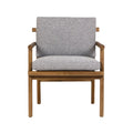 Front view of a patio armchair with a natural teak wood frame and light gray Sunbrella-upholstered seat and back cushion, featuring slim arms and tapered legs in a coastal modern style.