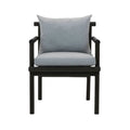 Front view of a patio armchair with a black teak wood frame and light gray Sunbrella fabric seat and back cushions, straight arms and square legs.