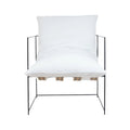 Front view of a modern armchair with plush white linen seat and back cushions, exposed natural webbing straps beneath the seat, and a slim black metal frame in a minimalist style.