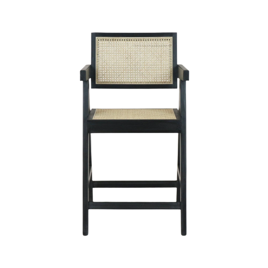 Front view of a mid-century modern bar stool with natural rattan cane seat and back set in a black wooden frame with armrests and horizontal footrest bars.