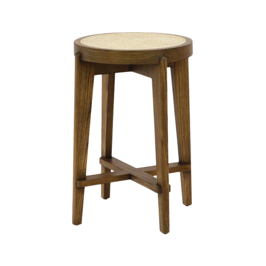 Backless round counter stool with a natural rattan woven seat on a medium-brown solid wood frame, tapered legs and crossed stretchers, modern armless design for kitchen or counter seating.