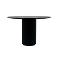 Round teak dining table in a smoked black finish with a thin circular top and a vertically fluted cylindrical pedestal base, photographed on a white background