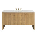 Modern 60-inch single-sink freestanding bathroom vanity in natural oak with a white stone quartz top, rectangular undermount sink, brass widespread faucet, three center drawers and two side cabinets with brass knobs.
