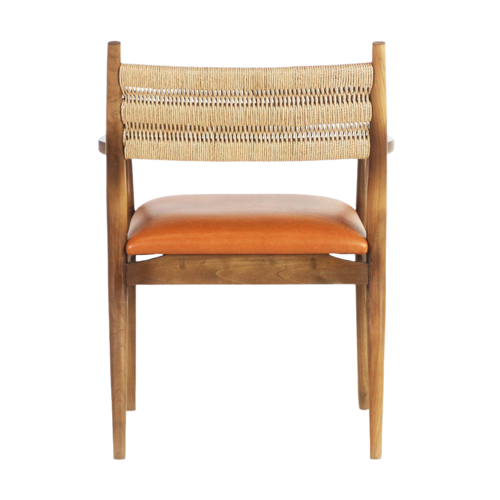 Rear view of a coastal-style dining chair featuring a woven natural rope back, warm tan faux-leather seat cushion and stained natural wood frame with tapered legs.