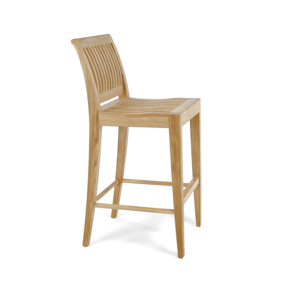 Natural teak armless outdoor bar stool with slatted curved seat and slatted back, tapered legs and integrated footrest in a coastal style on a white background.