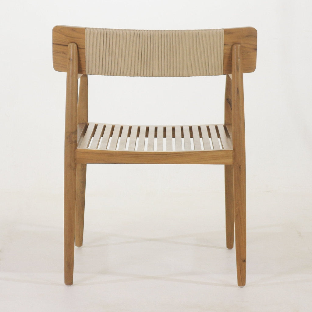 Front view of a natural teak outdoor dining chair with a slatted wooden seat, tapered legs, angled arms and a beige woven rope backrest.