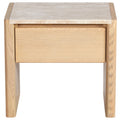 Front view of a modern natural wood nightstand with a beige marble top, a single recessed drawer and rounded legs, shown on a white background.
