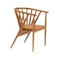 Three-quarter view of a natural teak Shaker-style dining chair with a rounded top rail, slender spindle back, integrated armrests and a solid wood seat on tapered angled legs.