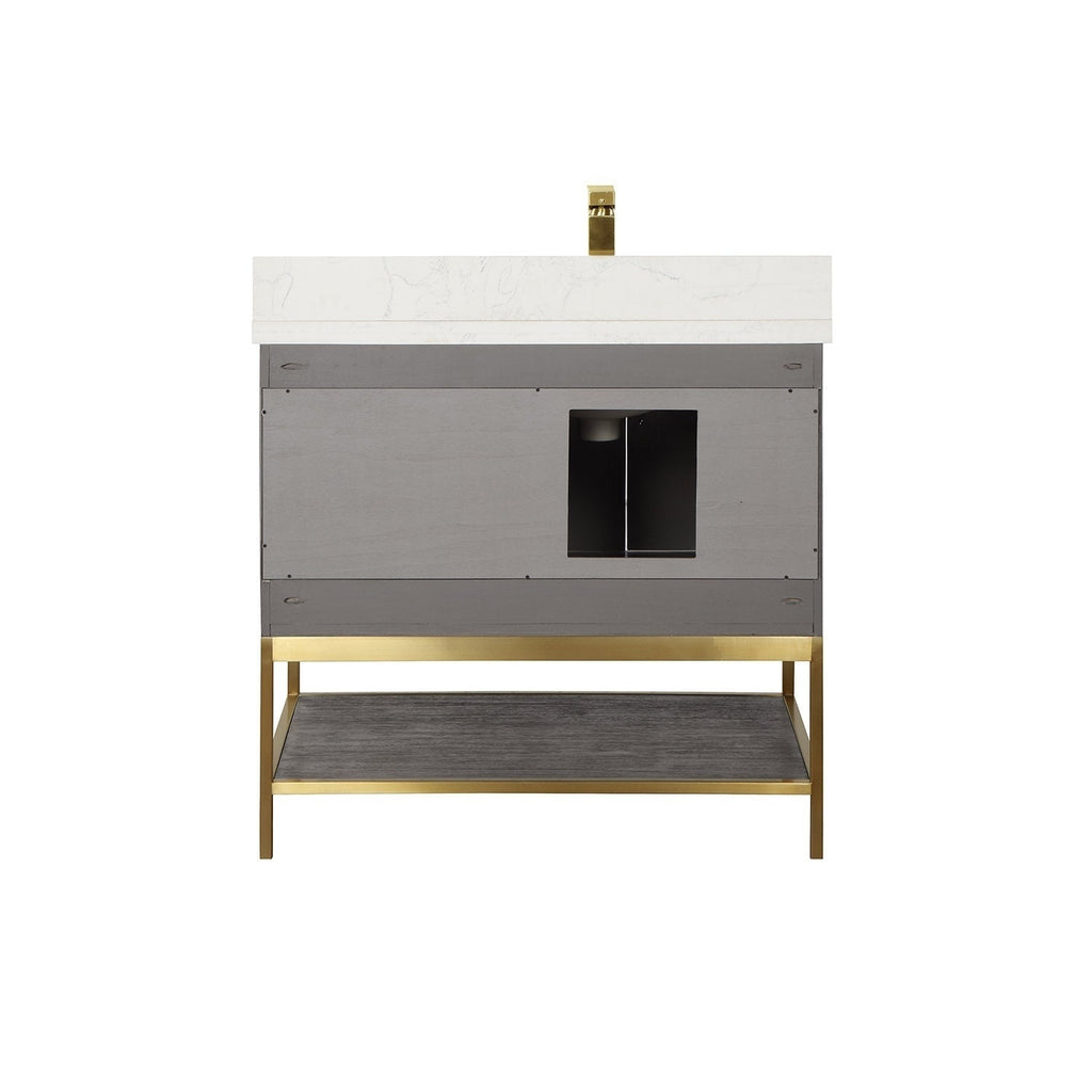 Front view of a 36-inch modern single-sink vanity with a white stone countertop and brass faucet, gray solid-wood cabinet with central plumbing cutout, and an open dark-wood lower shelf on a brass metal base.