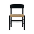 Front-facing mid-century modern Danish dining chair with a black solid wood (mahogany) frame, curved backrest and a natural woven papercord seat.