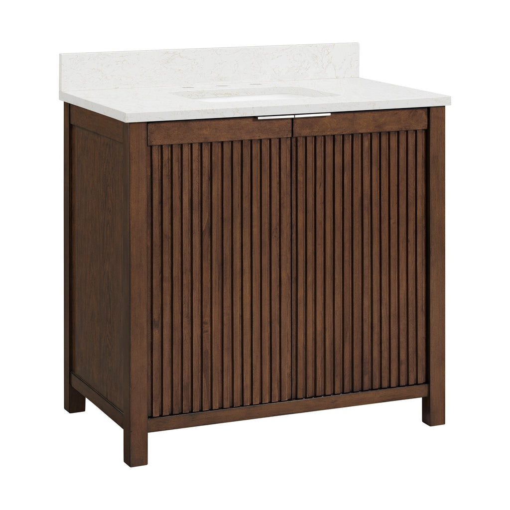 Freestanding modern single-sink bathroom vanity in rich brown solid wood with vertical fluted cabinet front, white stone countertop and backsplash with integrated rectangular sink and slim chrome handle.