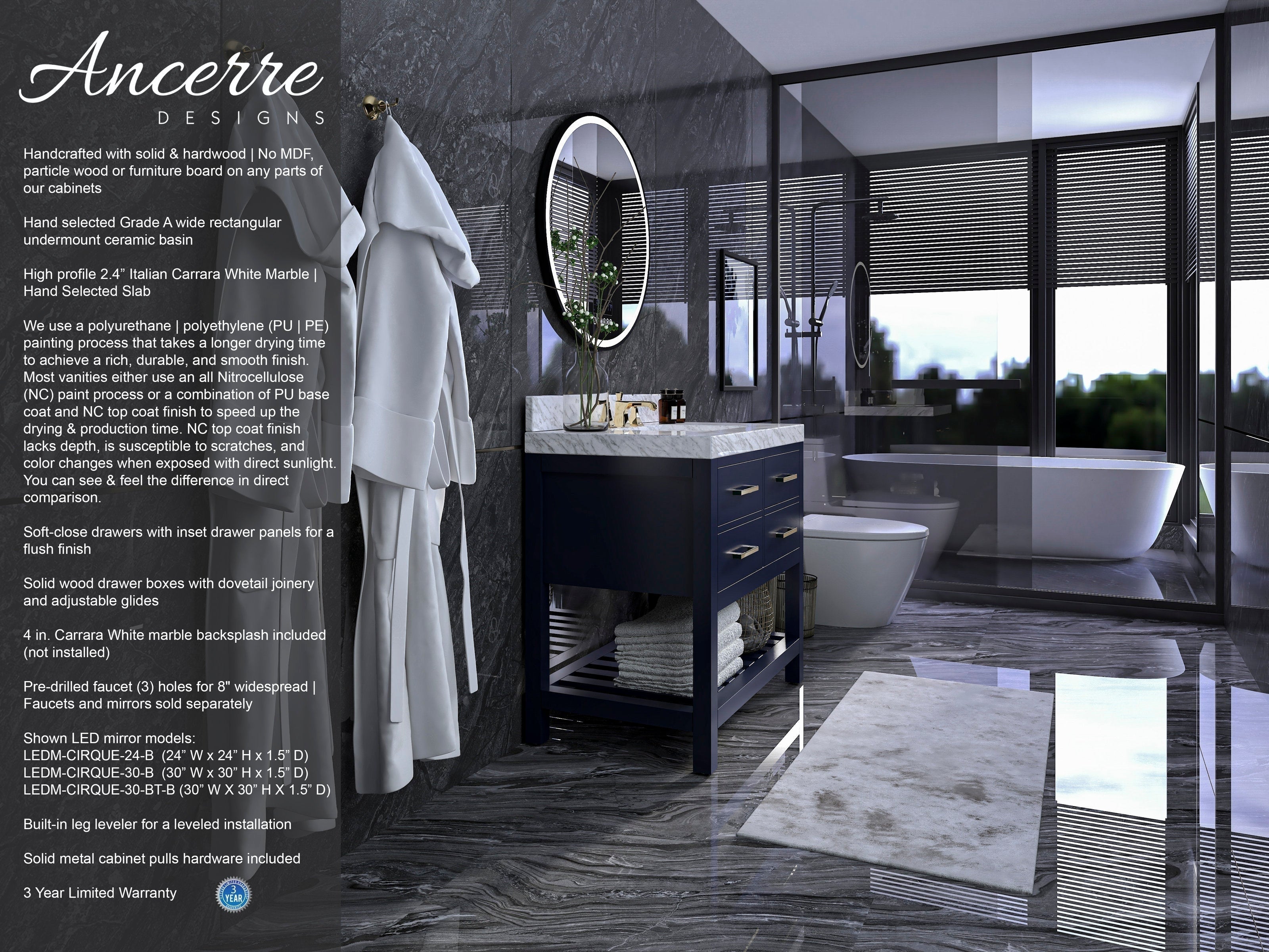 Modern solid-wood single-sink vanity in dark navy with a white Carrara-style stone countertop, round LED mirror and brushed-gold pulls, set against gray marble walls and floor beside a glass shower and freestanding tub.