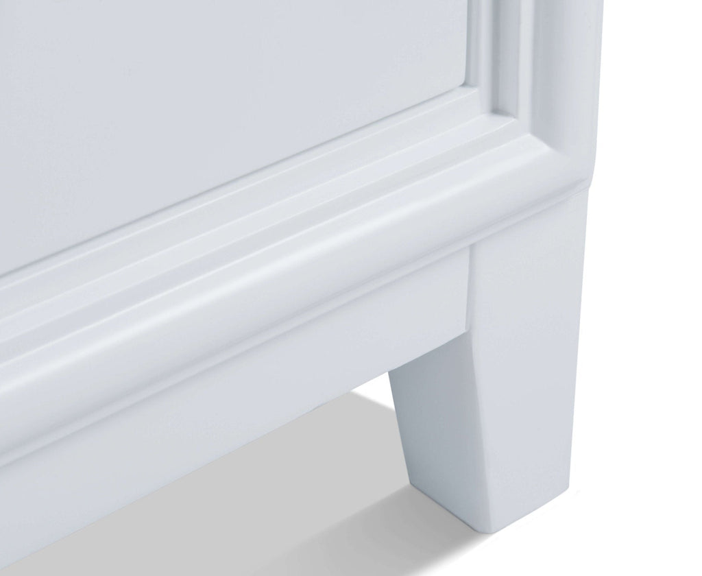 Close-up of the lower corner of a 60-inch stone-finish solid wood bathroom vanity, highlighting the molded apron trim and square tapered leg in a smooth stone color.