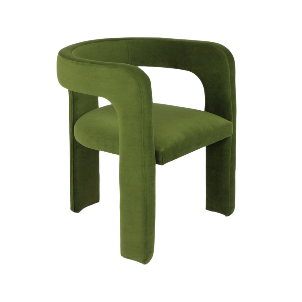 Modern green mohair-upholstered dining chair with a C-shaped curved back, integrated arms and cushioned seat, fully upholstered over a wooden frame against a white background.