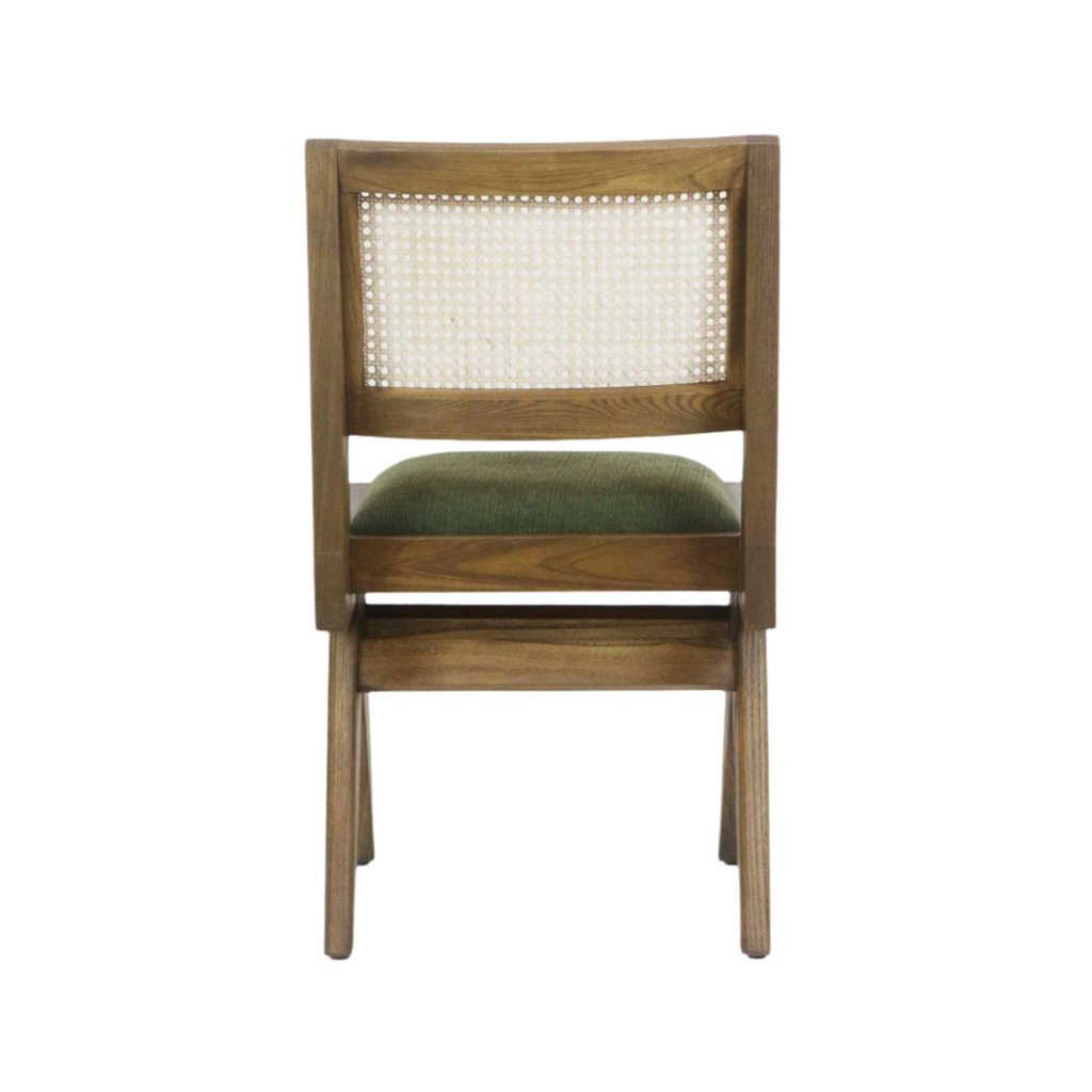 Rear view of an armless mid-century modern side chair with a natural wood frame, woven cane back panel and green upholstered seat cushion.