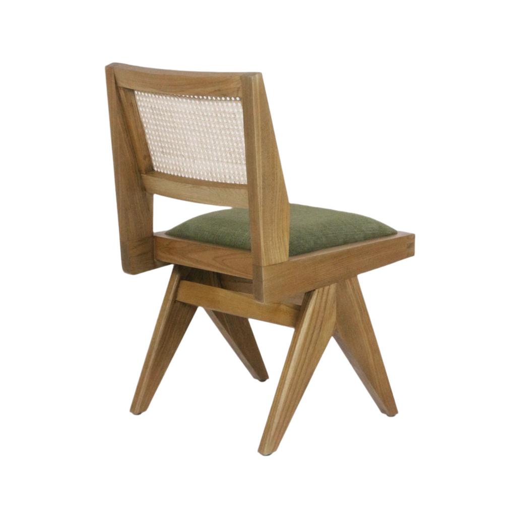 Armless mid-century modern side chair with a natural ash wood frame, woven cane back panel and green upholstered seat, shown from a rear three-quarter angle highlighting the angled legs.