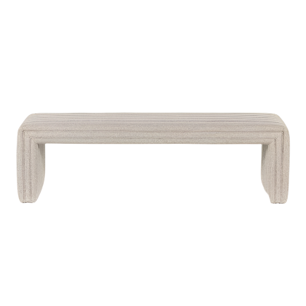Natural beige fabric-upholstered end-of-bed bench with continuous curved U-shaped legs, low modern coastal silhouette and horizontal channel texture across the seat.