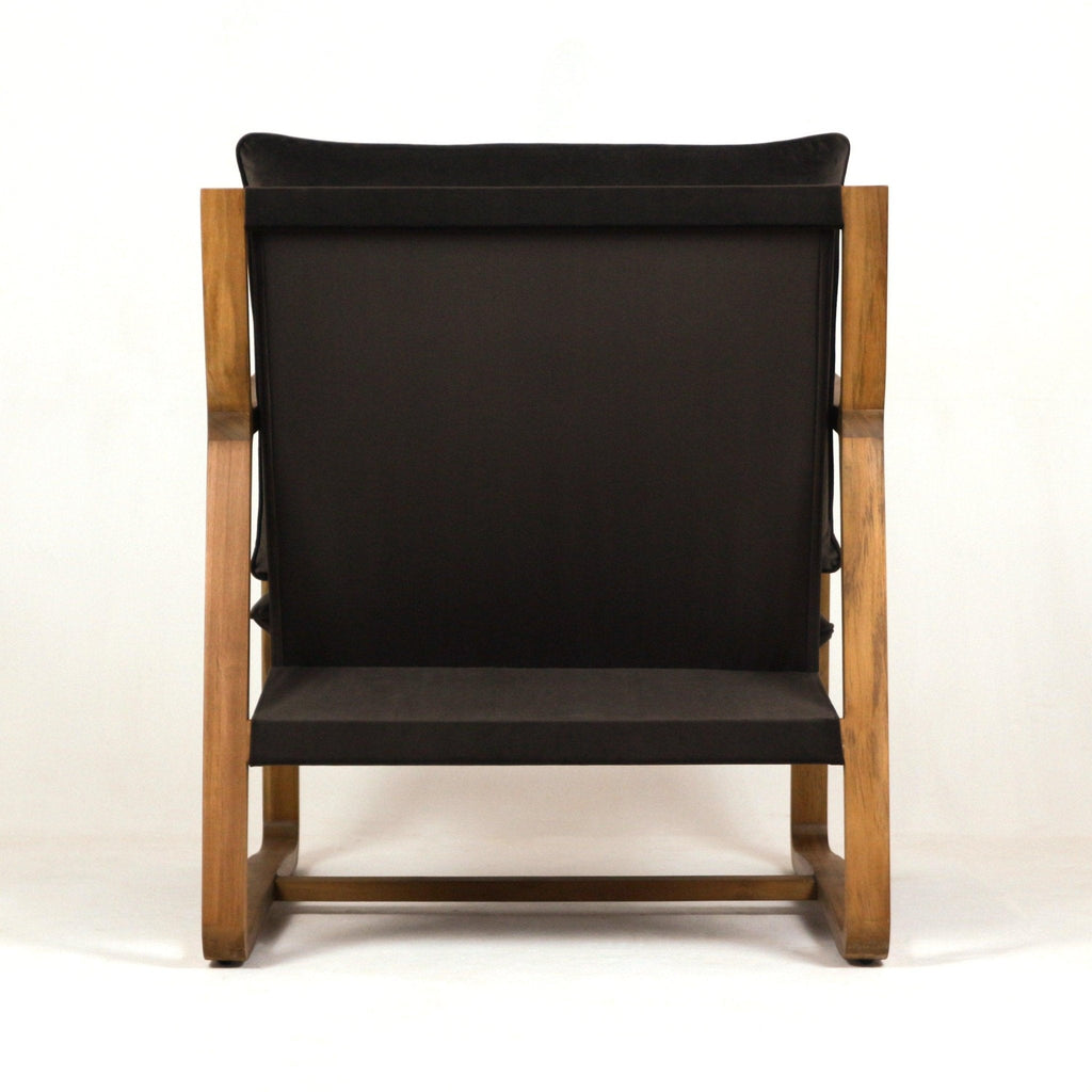 Back view of a mid-century modern accent chair featuring a solid oak frame and dark olive-green velvet upholstery with a low-profile seat and exposed wooden legs.