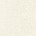 Close-up of cream boucle woven upholstery fabric for sofas, showing a soft nubby texture; 24% wool, 11% linen, 15% viscose, 40% acrylic and 10% polyester blend.