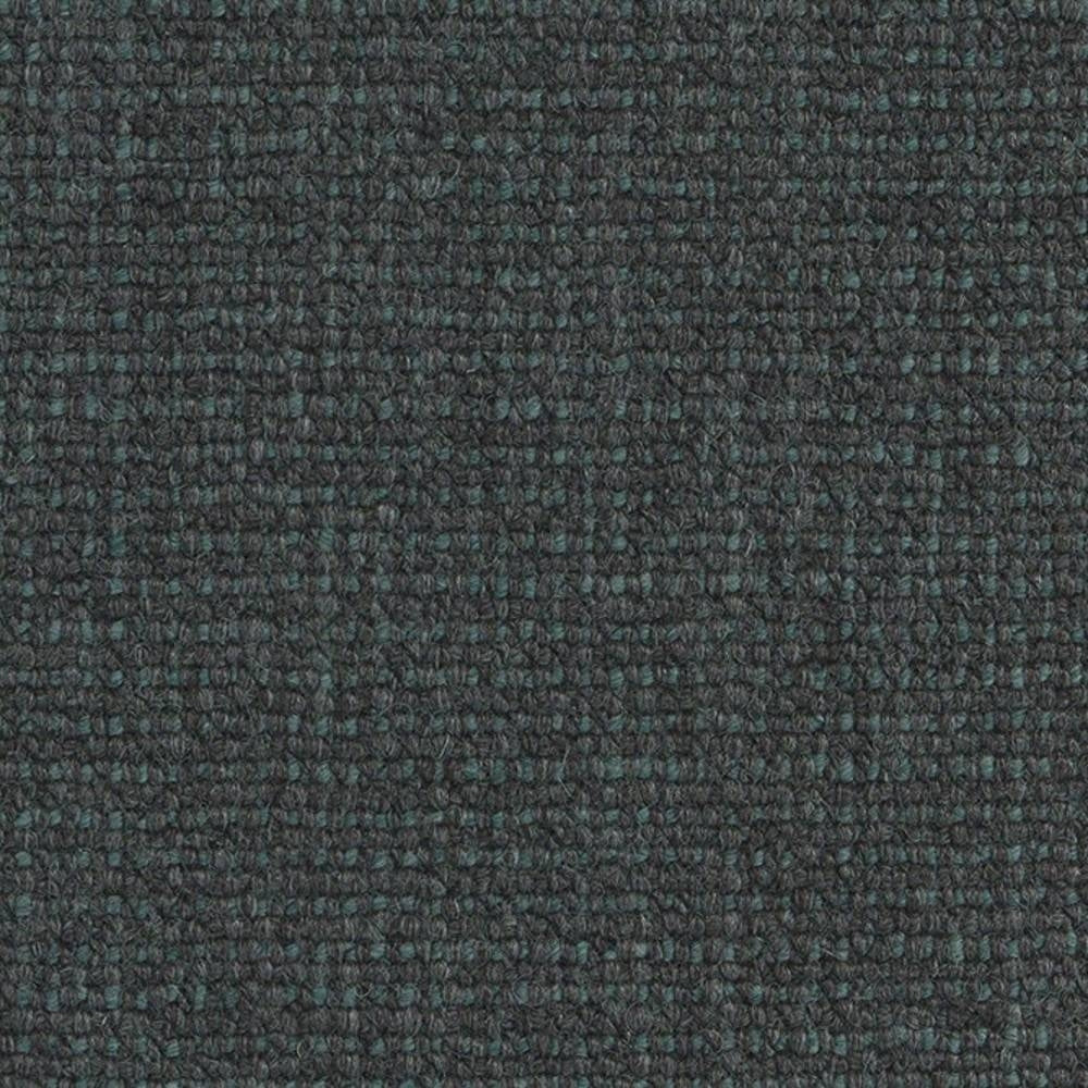 Close-up of dark charcoal fabric with subtle teal flecks and a tight boucle looped weave, suitable for sofa upholstery; 18% wool, 67% acrylic and 15% polyester.
