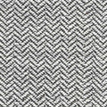 Close-up of gray and white herringbone upholstery fabric showing a textured looped weave; 13% wool, 50% acrylic, 37% polyester, suitable for contemporary sofa upholstery.
