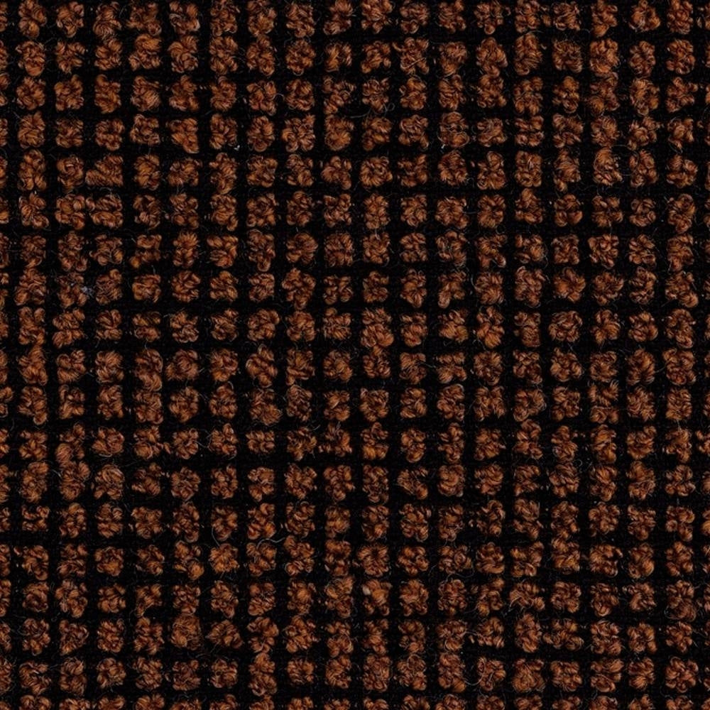 Close-up of boucle sofa upholstery showing a dark brown looped-yarn grid on a black woven ground; 25% wool, 40% acrylic, 35% polyester blend highlighting textured, durable woven loops.