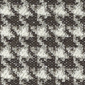 Close-up of black-and-white boucle upholstery fabric showing a textured small-scale houndstooth pattern with looped yarns and woven base; 25% wool, 44% acrylic, 21% cotton, 10% polyester blend.