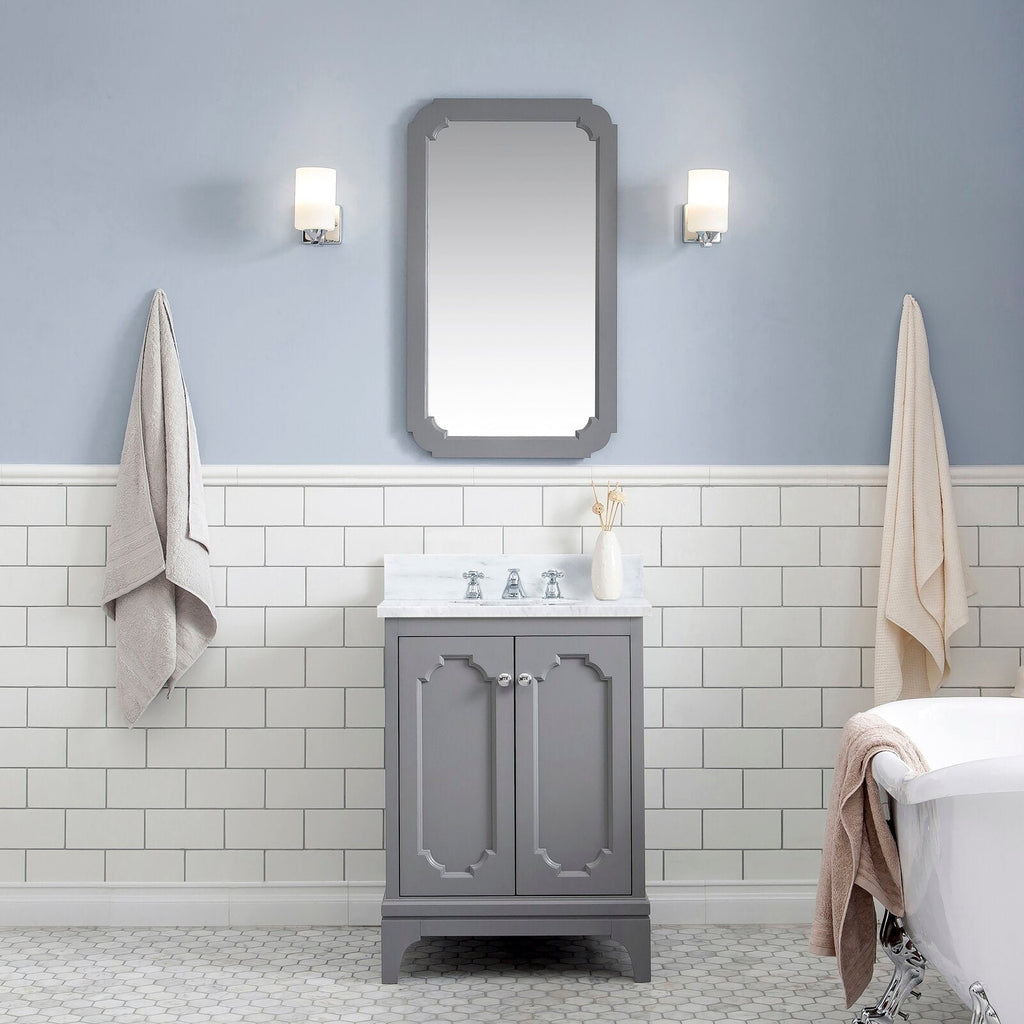 Single-sink cashmere grey vanity with Carrara white marble countertop, chrome classic faucet and matching framed mirror, flanked by two wall sconces over white subway tile and hex floor tile next to a clawfoot tub.